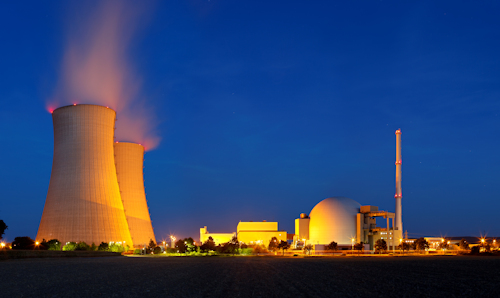 Nuclear power plant at night time