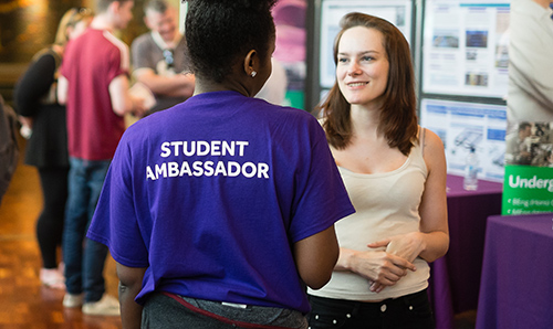 A student ambassador in conversation with a prospective student on an open day