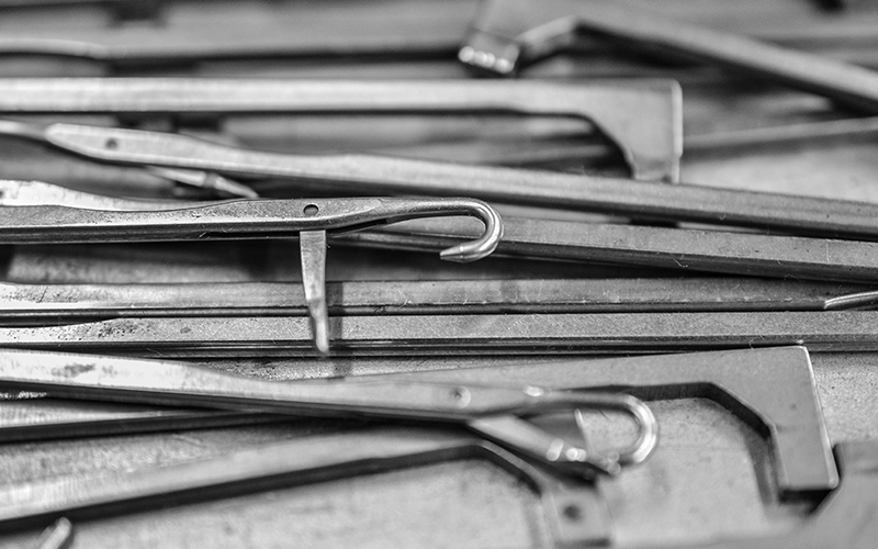 Metallic implements lying on top of one another