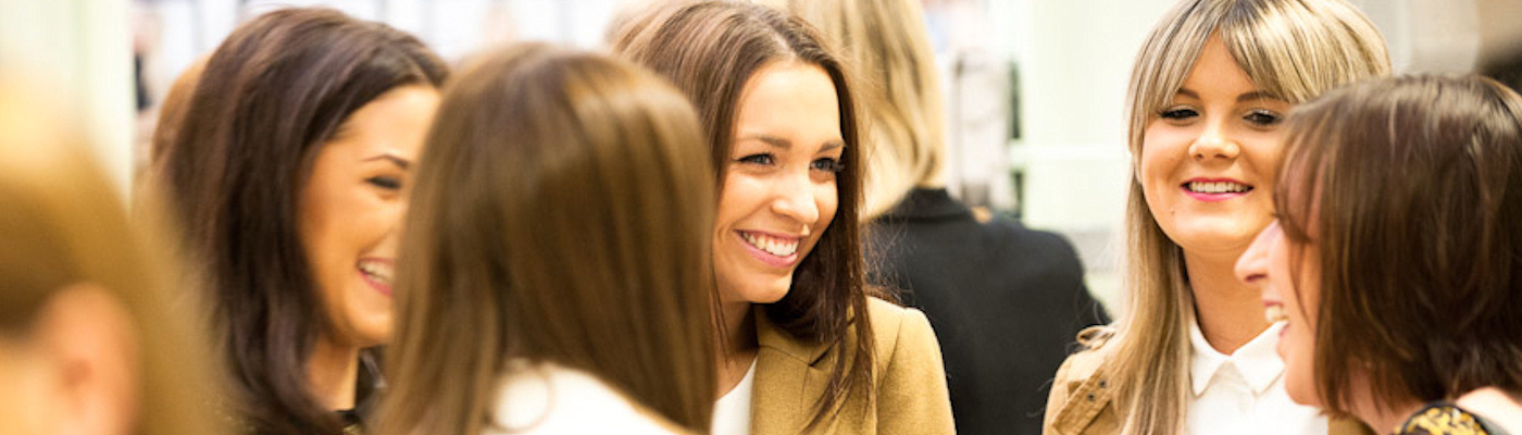 Smiling people talking at an event