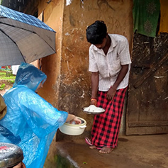 People sharing food in Kerala, India
