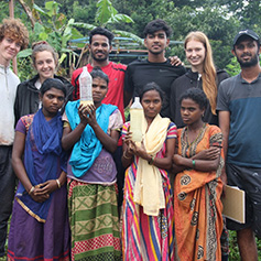 People in Kerala, India holding up bottles of water