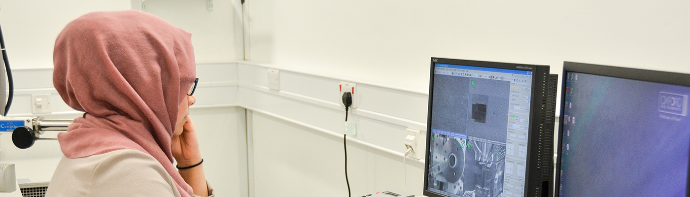 Researcher working at a computer in a laboratory