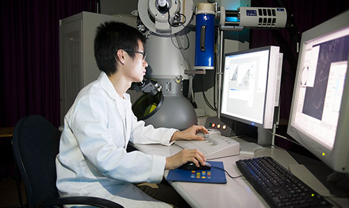 Student assessing laboratory computer screens