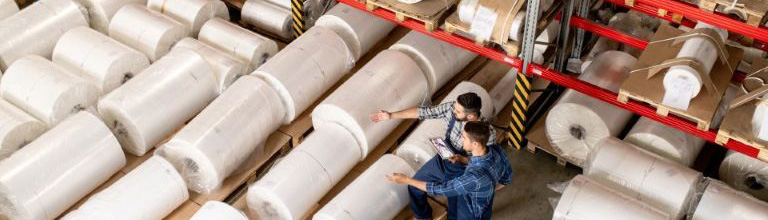 Warehouse workers with fabric