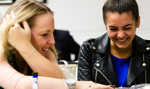 Two female students laughing