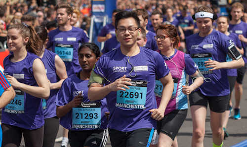 Section of purple wave - university staff and students in Manchester 10K