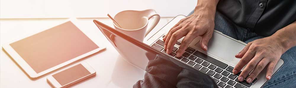 Relaxed student using a laptop