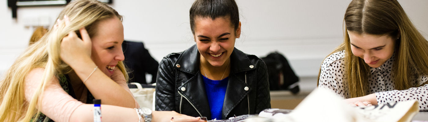 Three Department of Materials students laughing